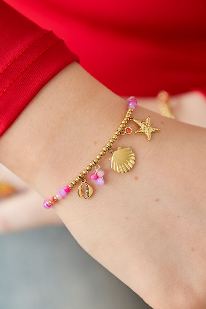 Bracelet de la mer fuchsia – Charms coquillages et perles