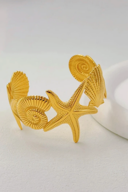 Bracelet jonc doré en acier inoxydable – Coquillages et étoile de mer