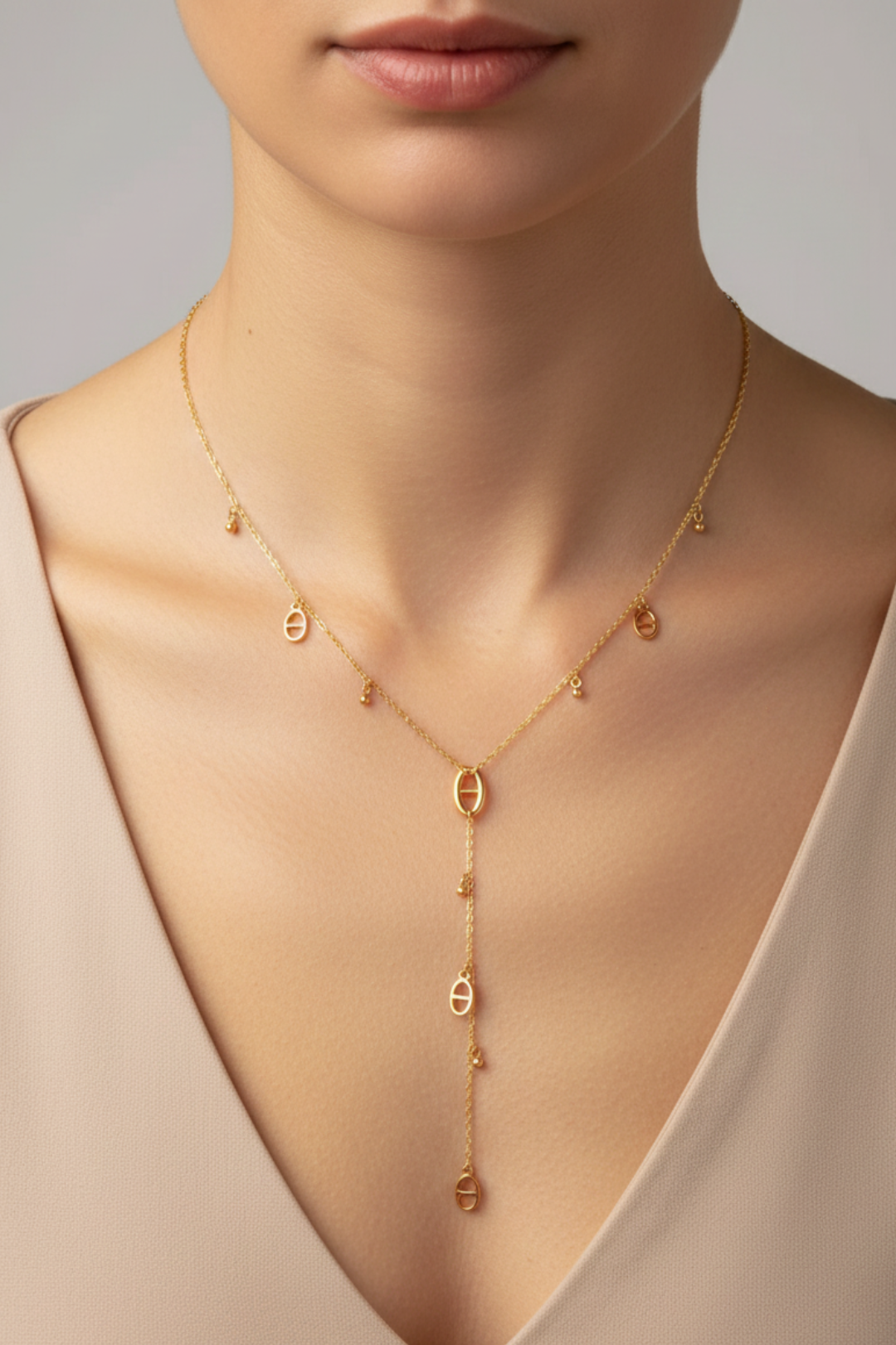 Collier Y doré en acier inoxydable « Cascade d’Ovales » – chaîne délicate & pendentifs raffinés