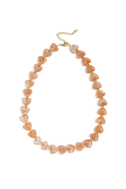 Collier coeurs en acrylique et acier inoxydable tanne