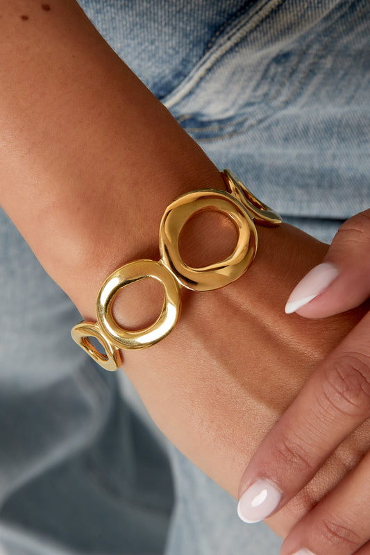 Bracelet manchette doré à formes ovales en acier inoxydable