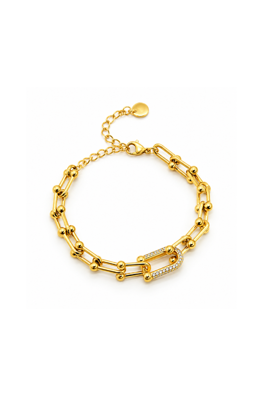 Bracelet doré à maillons allongés et billes avec maillon central brillant
