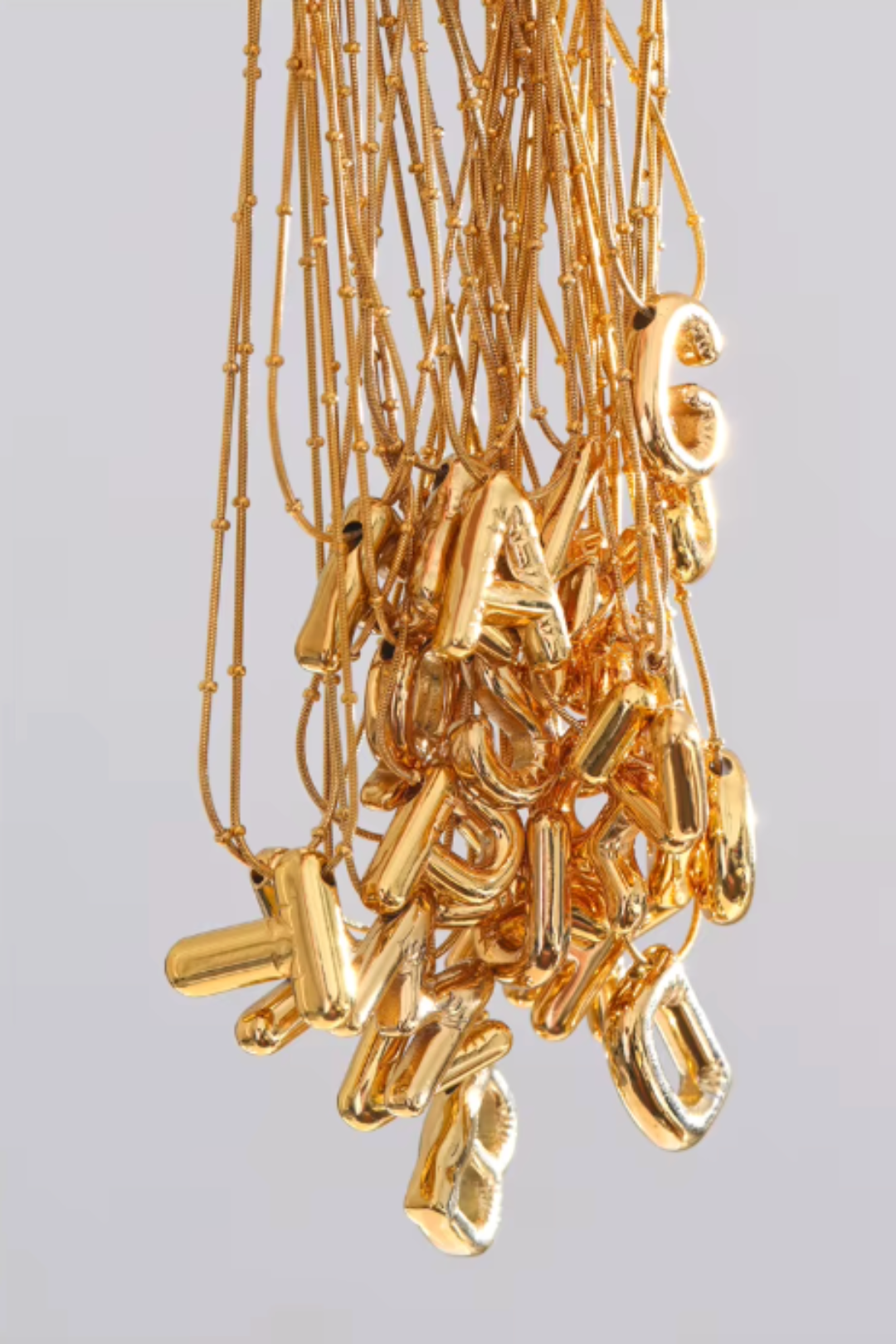 pendentif initiale acier inoxydable doré